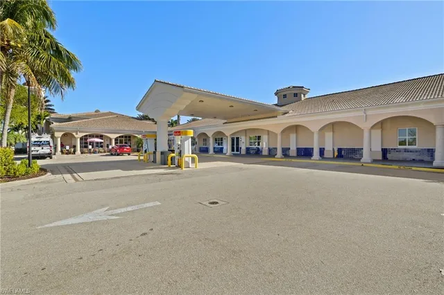 a view of white house with a street