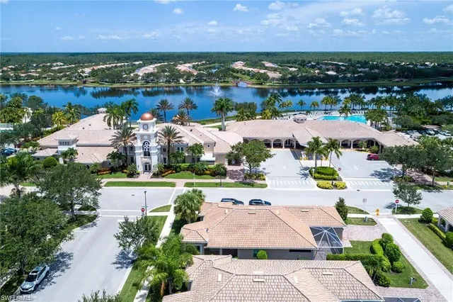 an aerial view of a house with a lake view
