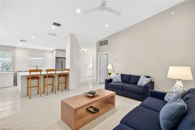 a living room with furniture and a table
