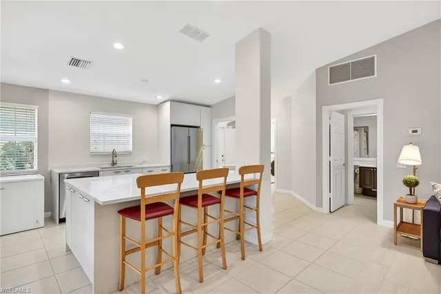 a view of a dining room with furniture and window