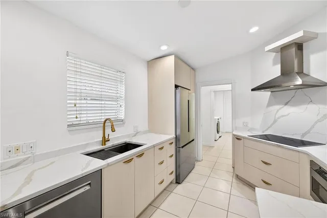 a kitchen with a sink and cabinets