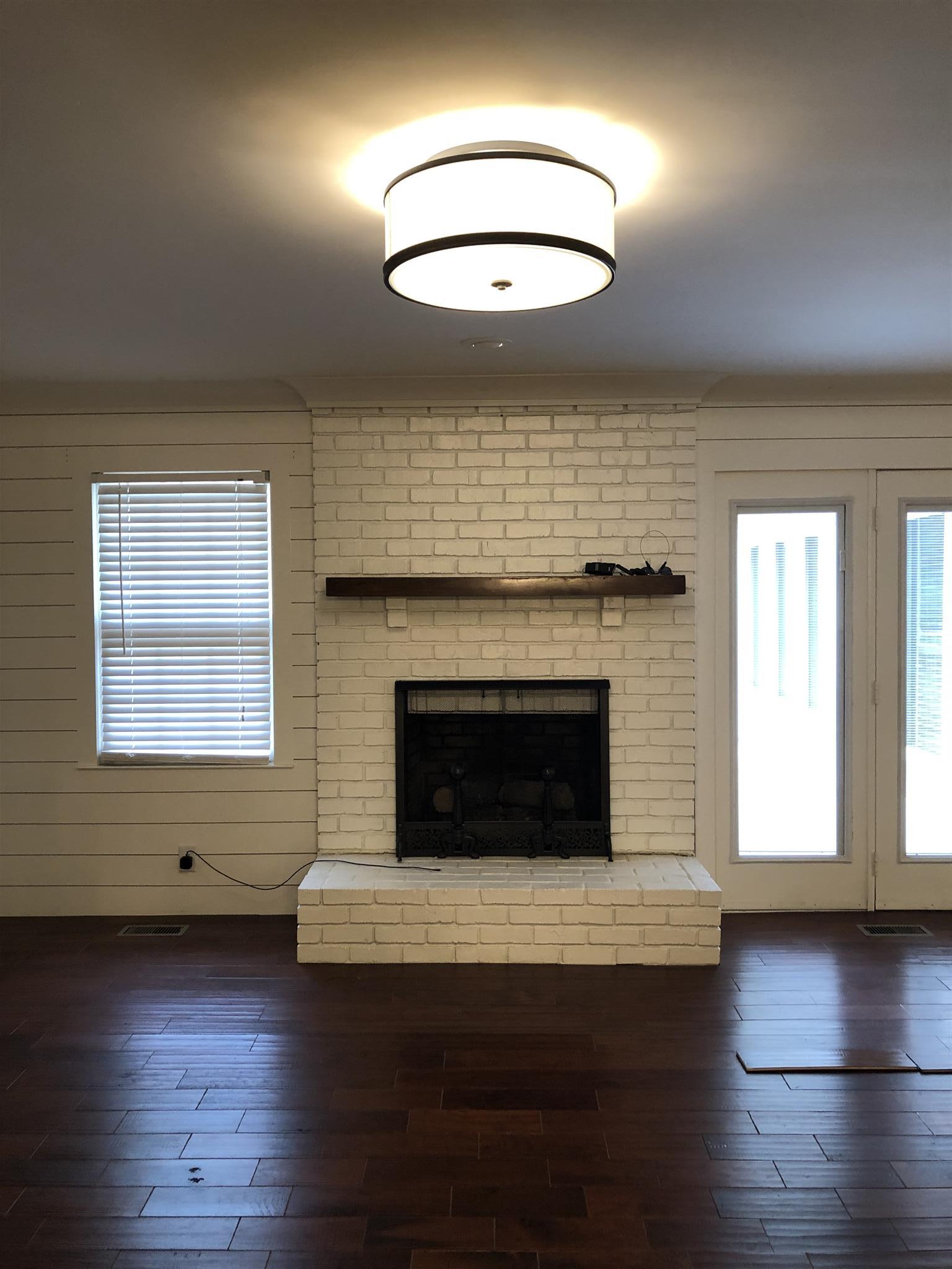 208 Riggs Avenue Portland, TN 37148 - Photo 11 of 26 Fireplace in the family room which is visible from the kitchen