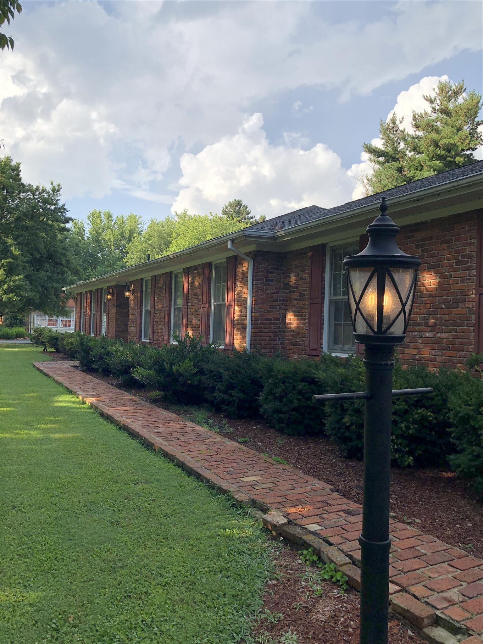 208 Riggs Avenue Portland, TN 37148 - Photo 21 of 26 Walkway to the entrance