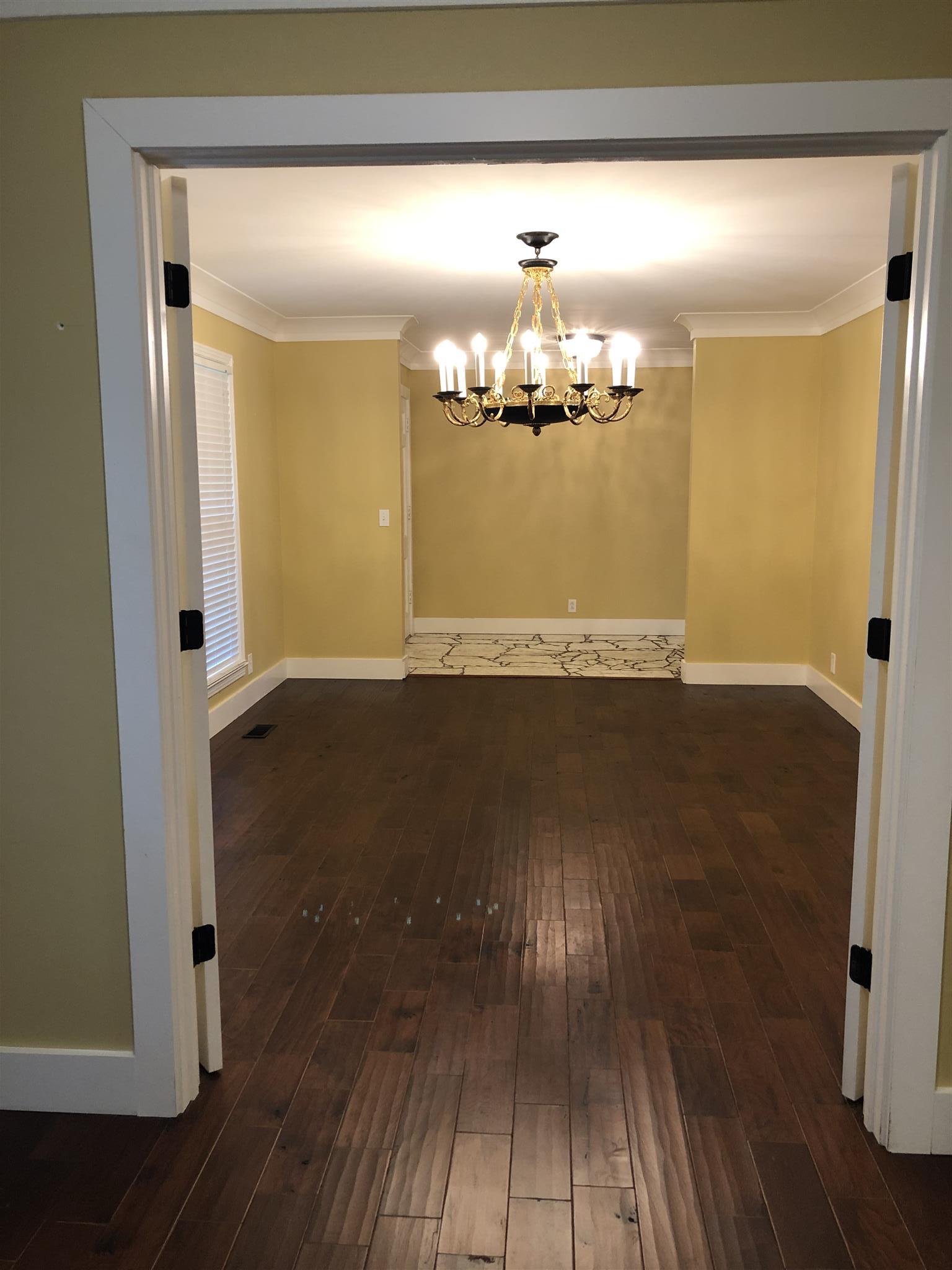 208 Riggs Avenue Portland, TN 37148 - Photo 4 of 26 Another view with the doors completely open to show how spacious the entry is.