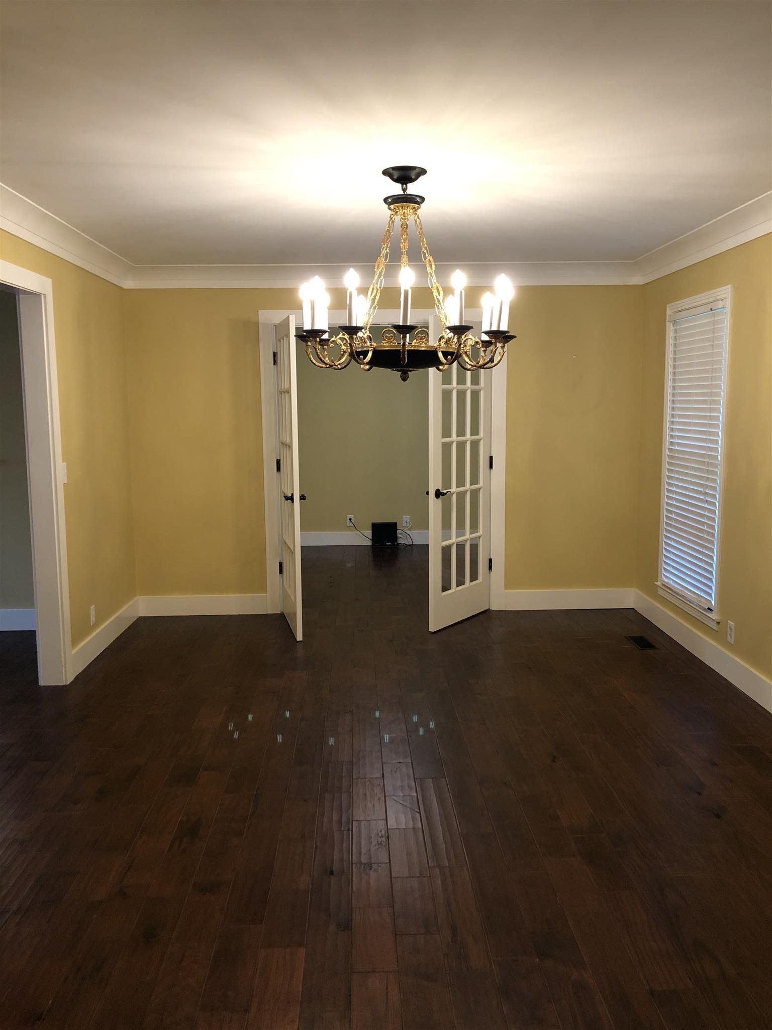 208 Riggs Avenue Portland, TN 37148 - Photo 5 of 26 A view from the foyer into the dining and additional room that would make a great office