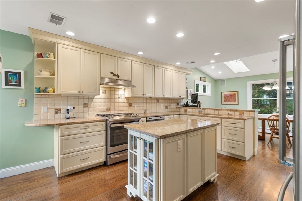34 Palmer Road Newton, MA 02468 - Photo 14 of 26 a kitchen with stainless steel appliances granite countertop a stove and cabinets