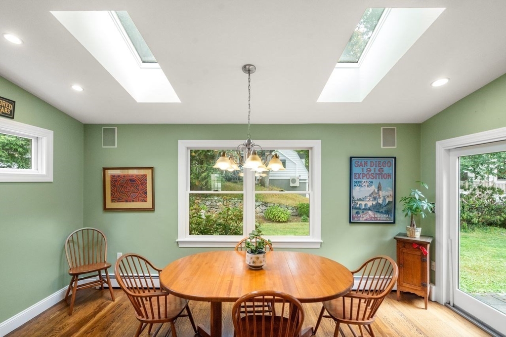 34 Palmer Road Newton, MA 02468 - Photo 16 of 26 a dining room with furniture a chandelier and wooden floor