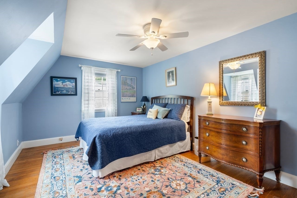 34 Palmer Road Newton, MA 02468 - Photo 20 of 26 a bedroom with a bed and wooden floor