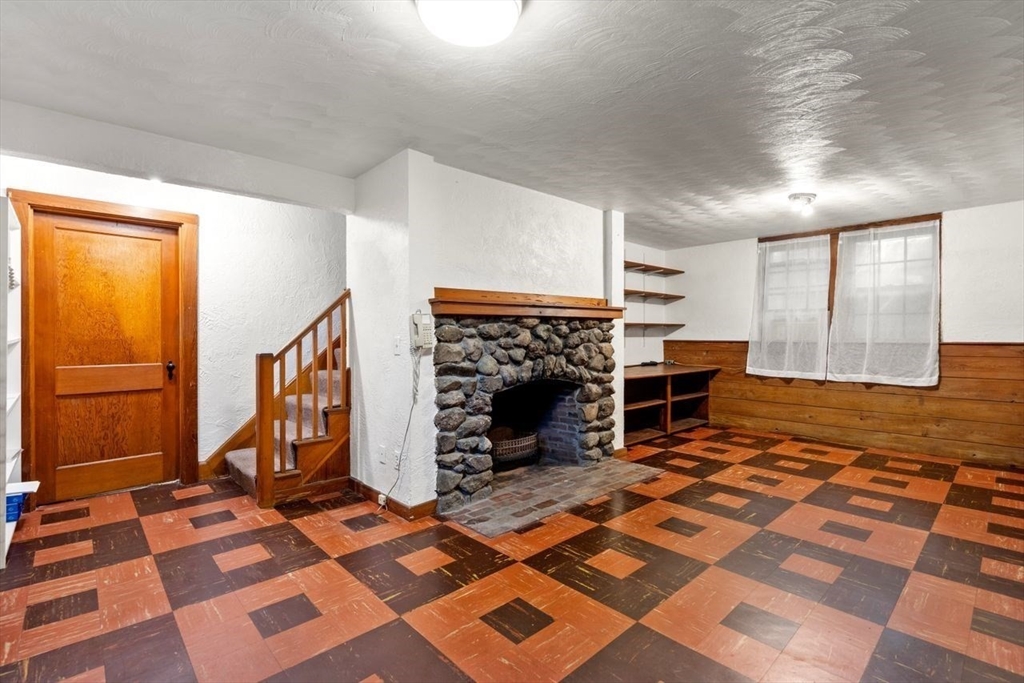 34 Palmer Road Newton, MA 02468 - Photo 21 of 26 a view of a livingroom with furniture and an empty room