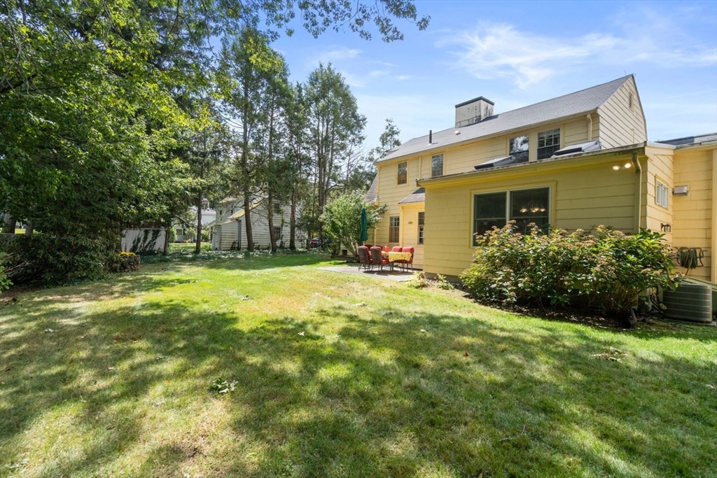 34 Palmer Road Newton, MA 02468 - Photo 22 of 26 a view of a house with a backyard