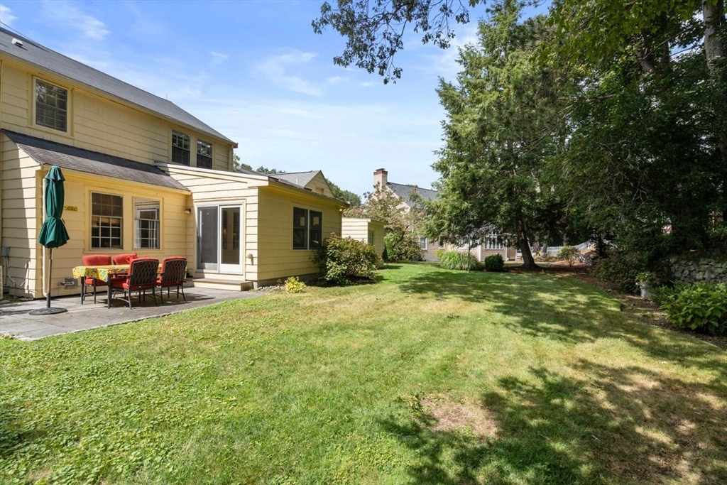 34 Palmer Road Newton, MA 02468 - Photo 23 of 26 a view of a house with backyard and sitting area
