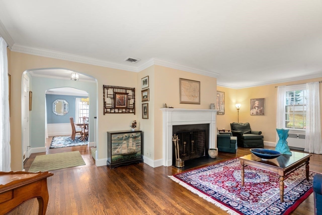 34 Palmer Road Newton, MA 02468 - Photo 4 of 26 a living room with furniture and a fireplace