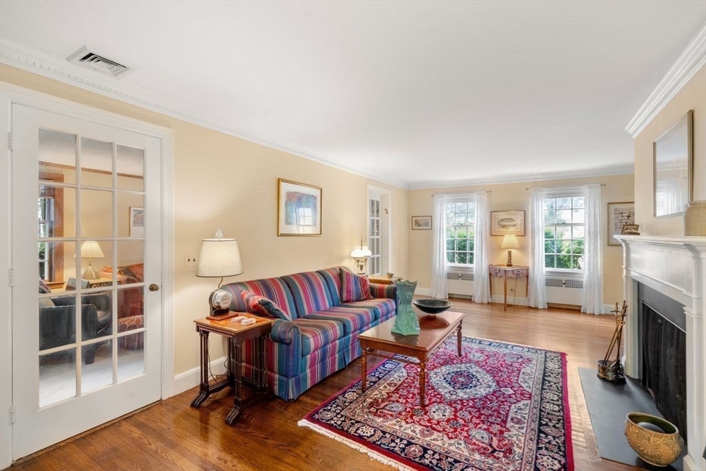 34 Palmer Road Newton, MA 02468 - Photo 7 of 26 a living room with furniture fireplace and a table
