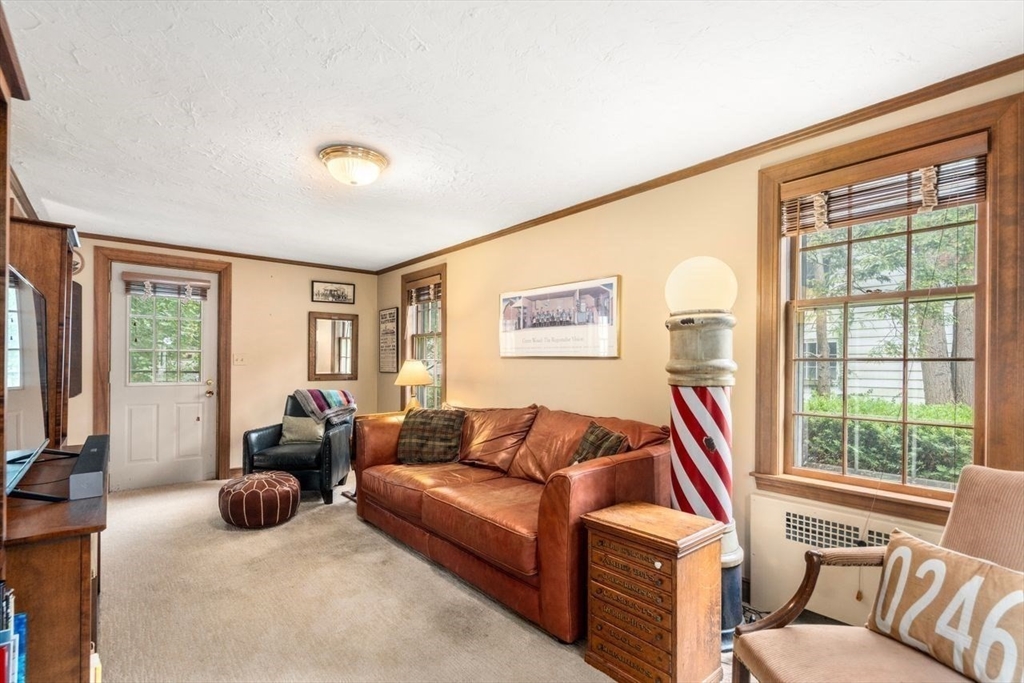34 Palmer Road Newton, MA 02468 - Photo 9 of 26 a living room with furniture and a large window