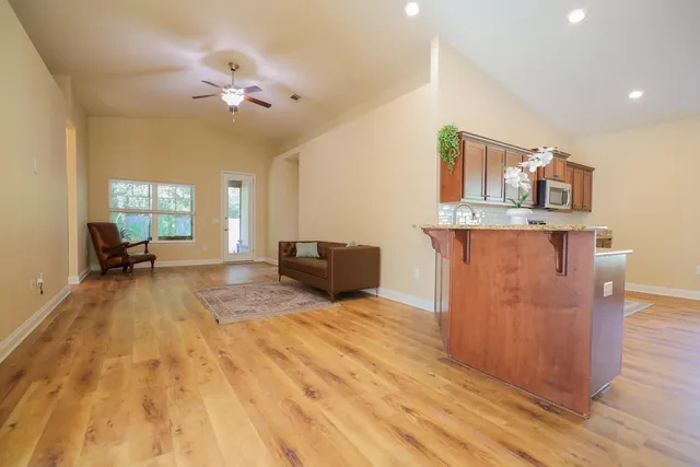 a living room with furniture and a rug