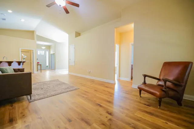 a living room with furniture and a window