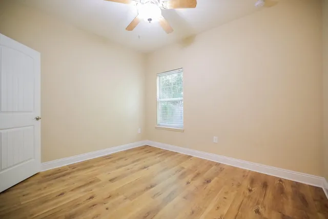 an empty room with a empty space and a window