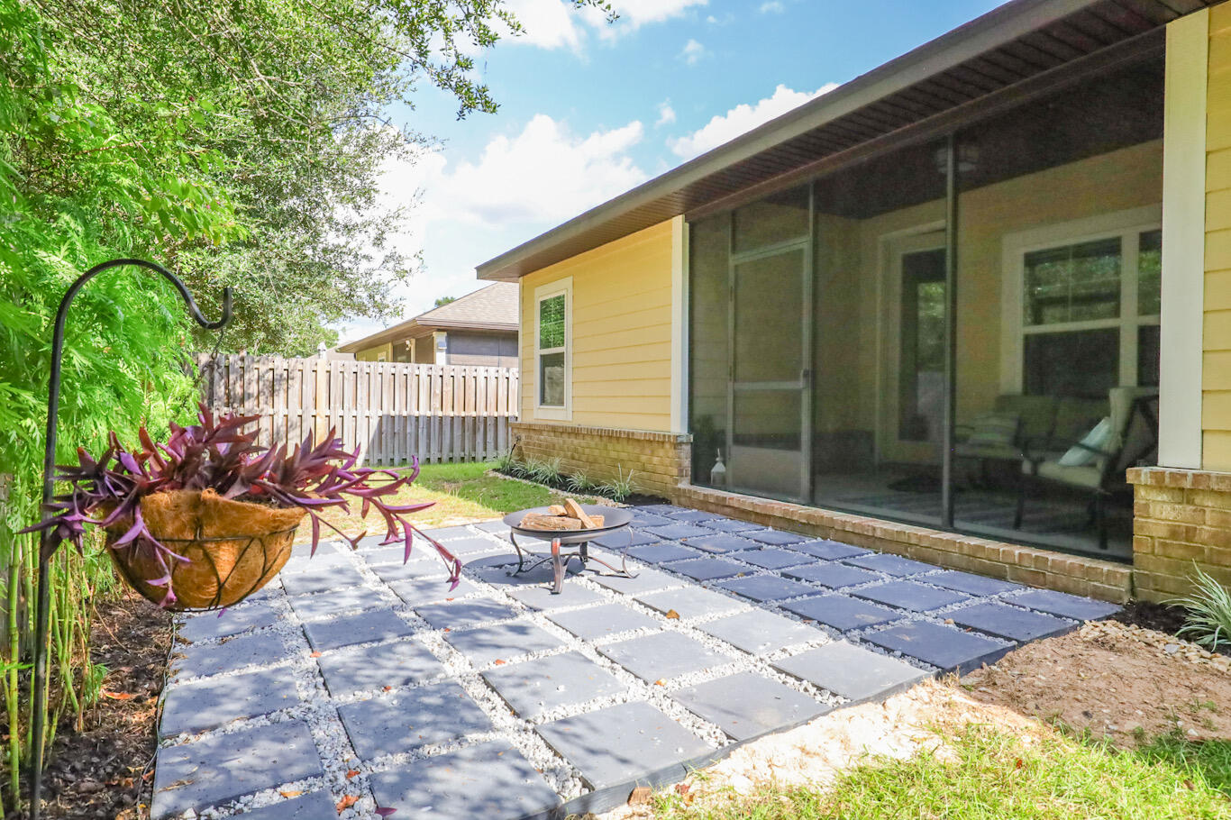 96 Benton Boulevard Freeport, FL 32439 - Photo 29 of 34 a chair and table in the back yard of a house