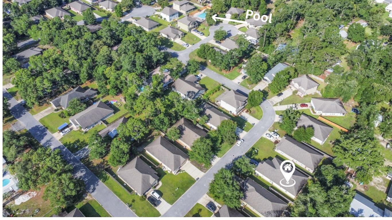 96 Benton Boulevard Freeport, FL 32439 - Photo 33 of 34 an aerial view of residential houses with outdoor space and trees
