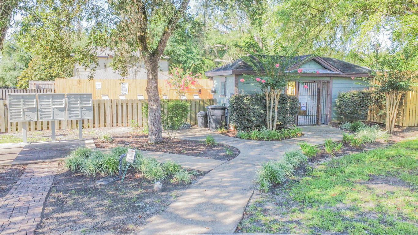 96 Benton Boulevard Freeport, FL 32439 - Photo 34 of 34 a front view of a house with garden