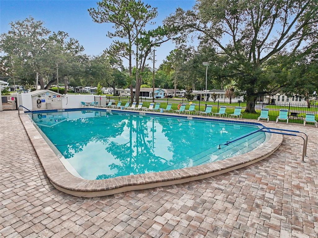 2092 Culbreath Road, Unit A42 Brooksville, FL 34602 - Photo 38 of 70 a view of a swimming pool with a patio