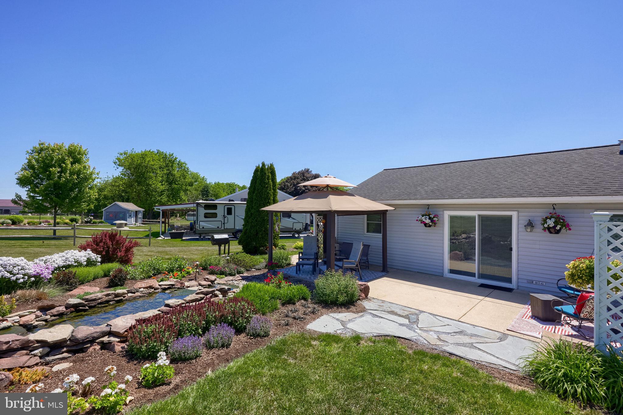 91 Buchland Road Ephrata, PA 17522 - Photo 52 of 59 Charming garden oasis in sunlight.