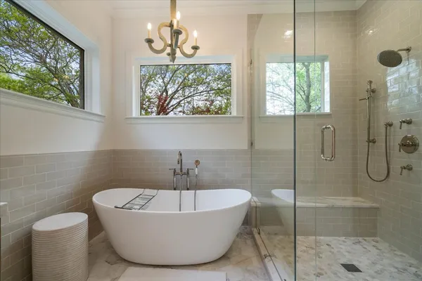 a bathroom with a bathtub and shower