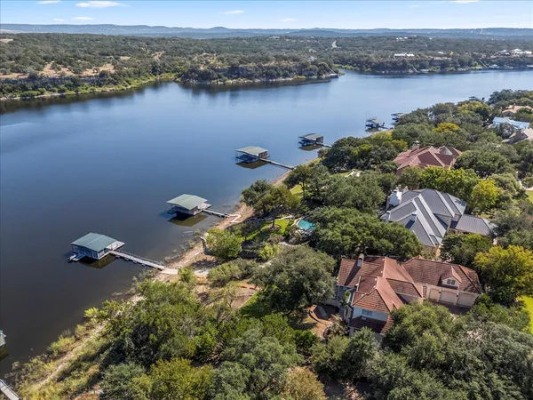 an aerial view of lake residential houses with outdoor space and lake view
