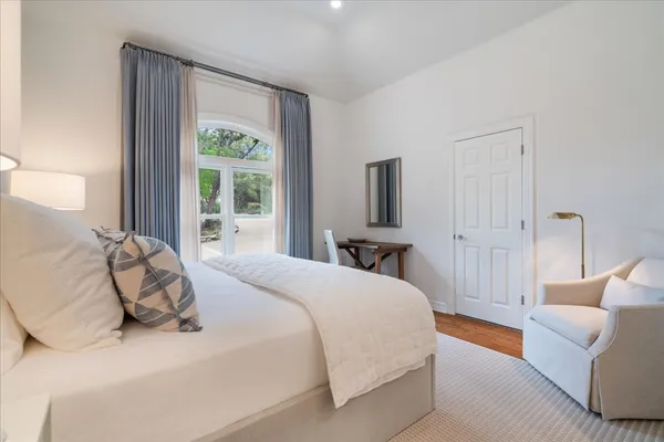 a bedroom with a bed and a couch