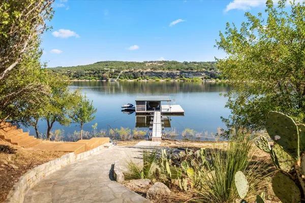 a view of a lake with a house in the background