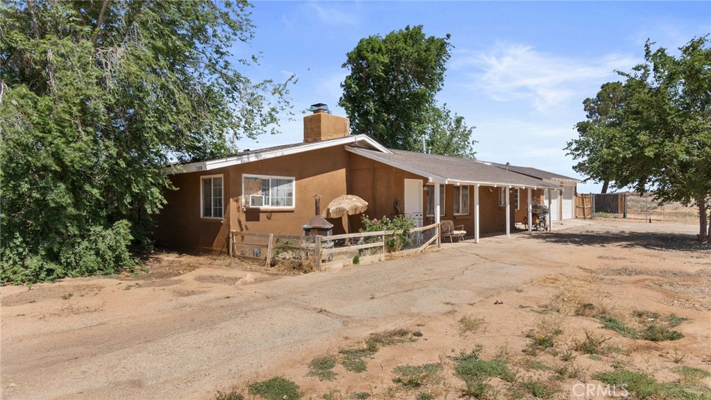 21874 Waalew Road Apple Valley, CA 92307 - Photo 1 of 1 a view of a house with backyard and sitting area