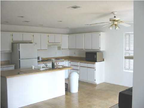 2642 Spring Lake Road DeFuniak Springs, FL 32433 - Photo 6 of 8 a kitchen with a sink cabinets and window