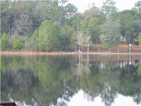 2642 Spring Lake Road DeFuniak Springs, FL 32433 - Photo 8 of 8 a view of lake with green space