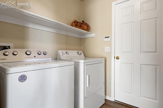 7655 Coffee Road Peyton, CO 80831 - Photo 11 of 31 Laundry room with washer and dryer.