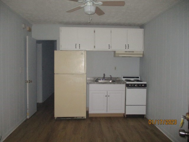 2706 Reese Road, Unit 5 Columbus, GA 31907 - Photo 3 of 6 a kitchen with a refrigerator and a stove top oven
