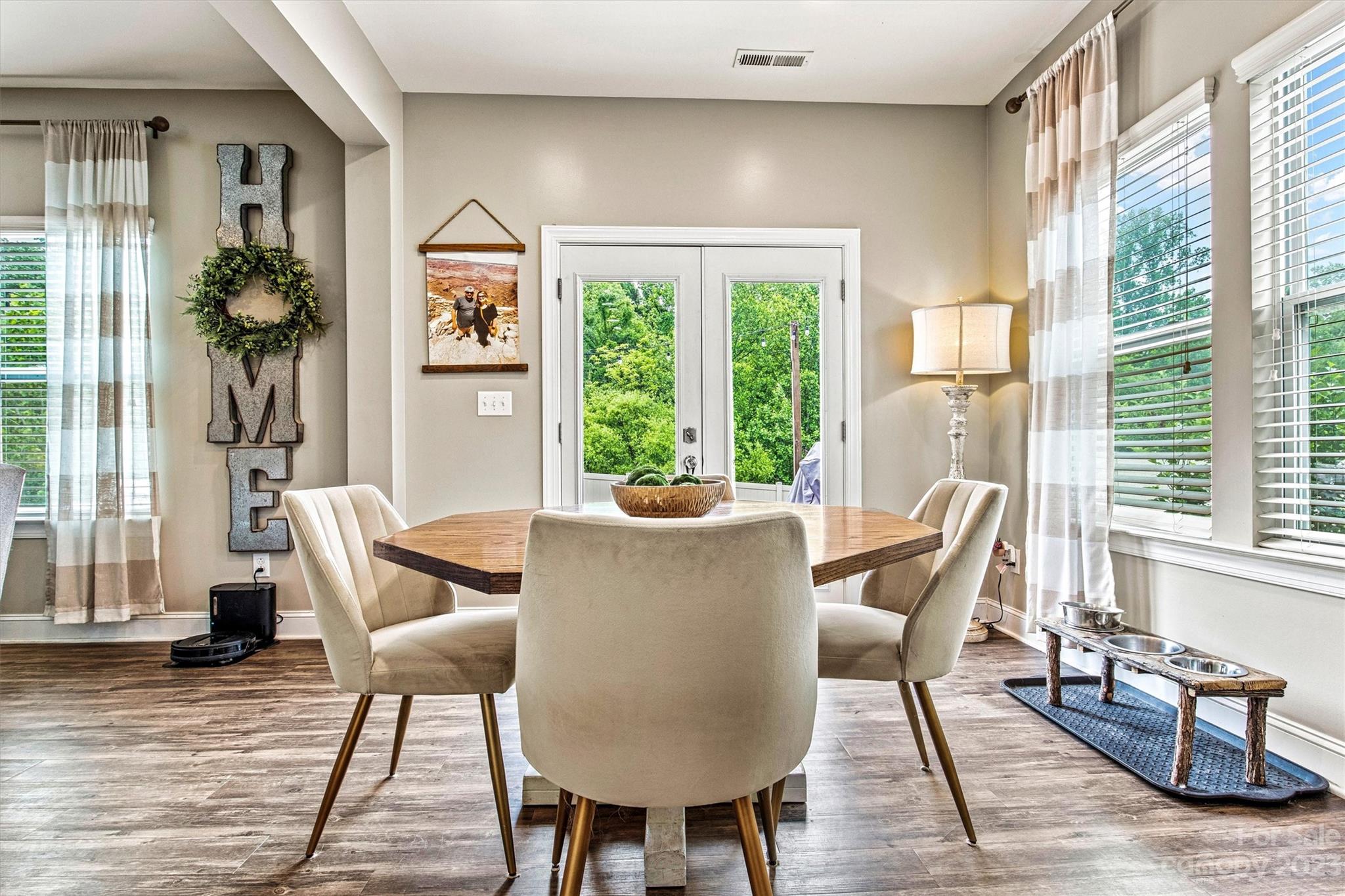 6054 Durango Way Denver, NC 28037 - Photo 11 of 38 a view of a dining room with furniture window and wooden floor