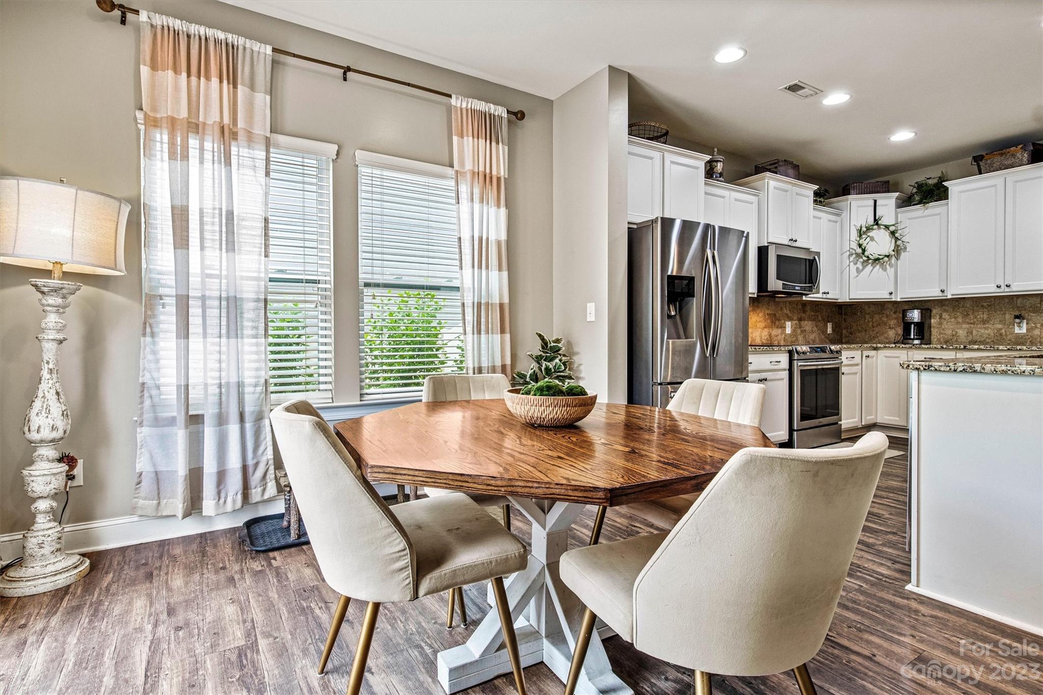 6054 Durango Way Denver, NC 28037 - Photo 12 of 38 a view of a dining room with furniture window and wooden floor