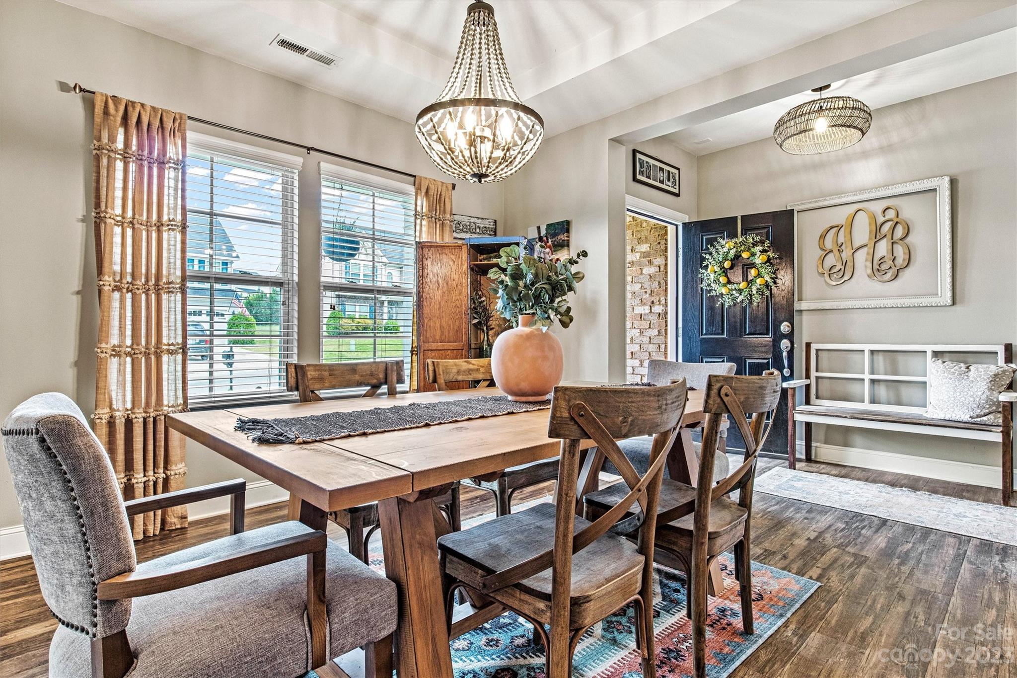 6054 Durango Way Denver, NC 28037 - Photo 13 of 38 a view of a dining room with furniture window and wooden floor