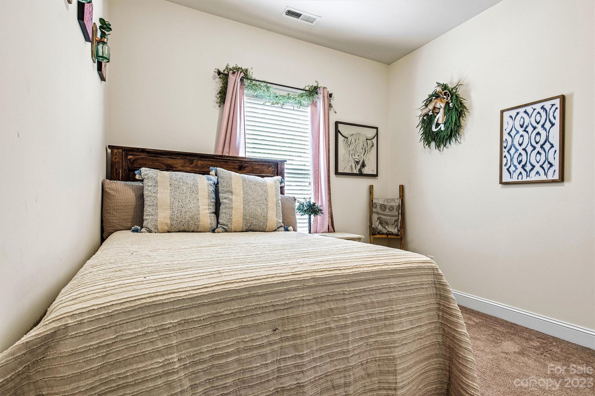 6054 Durango Way Denver, NC 28037 - Photo 15 of 38 a bedroom with a bed and a window