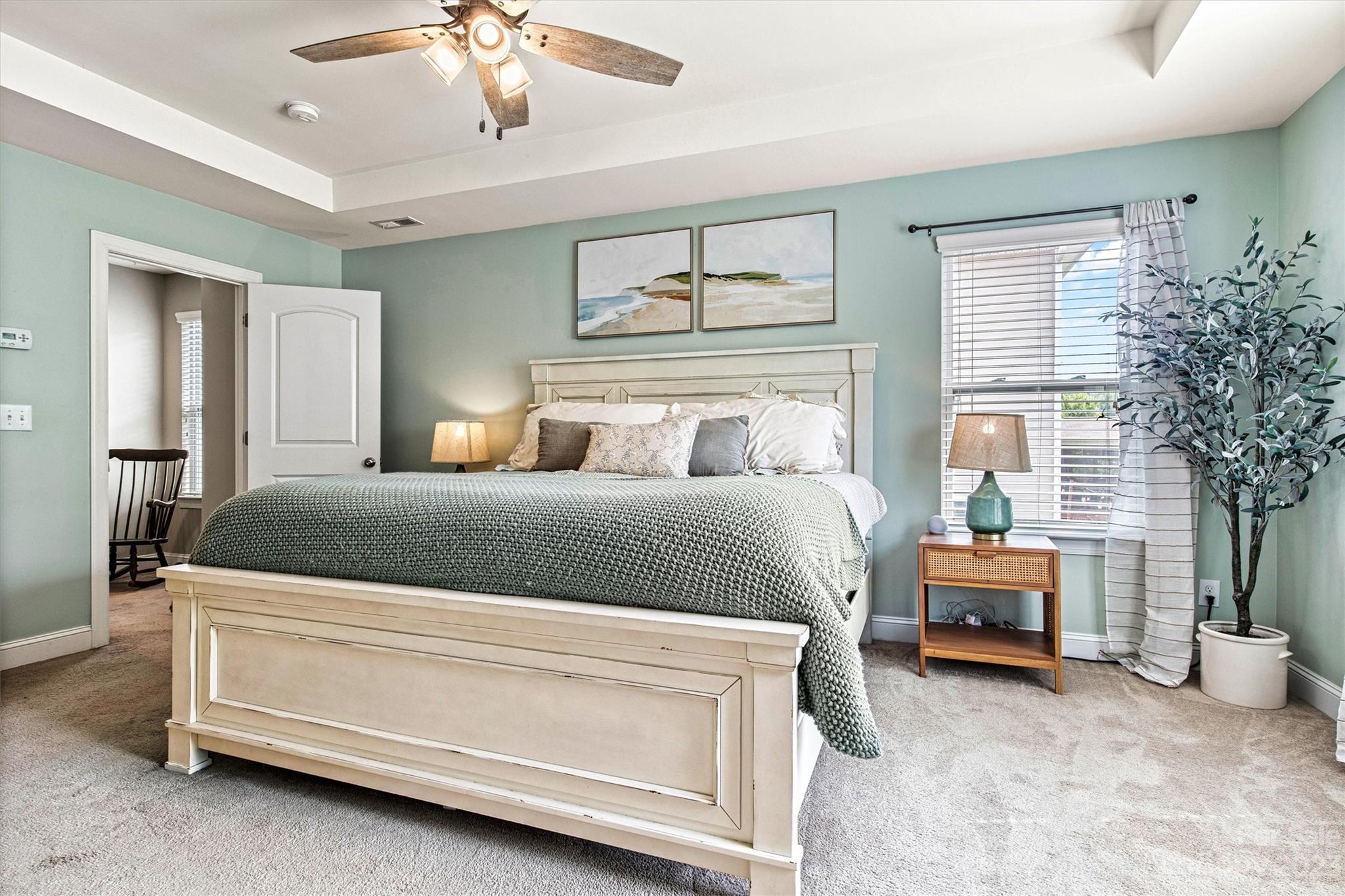 6054 Durango Way Denver, NC 28037 - Photo 20 of 38 a bedroom with a bed and a chandelier