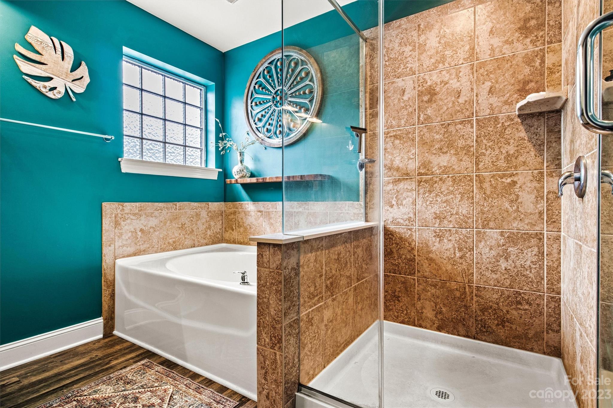 6054 Durango Way Denver, NC 28037 - Photo 22 of 38 a bathroom with a bathtub and a shower