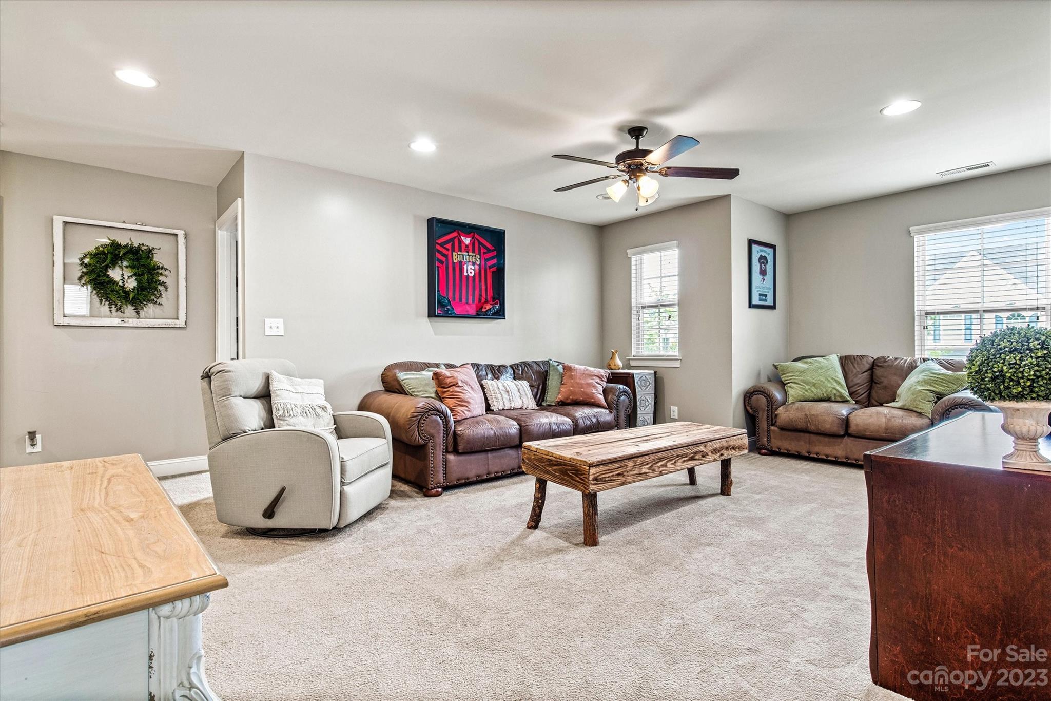 6054 Durango Way Denver, NC 28037 - Photo 24 of 38 a living room with furniture ceiling fan and a window