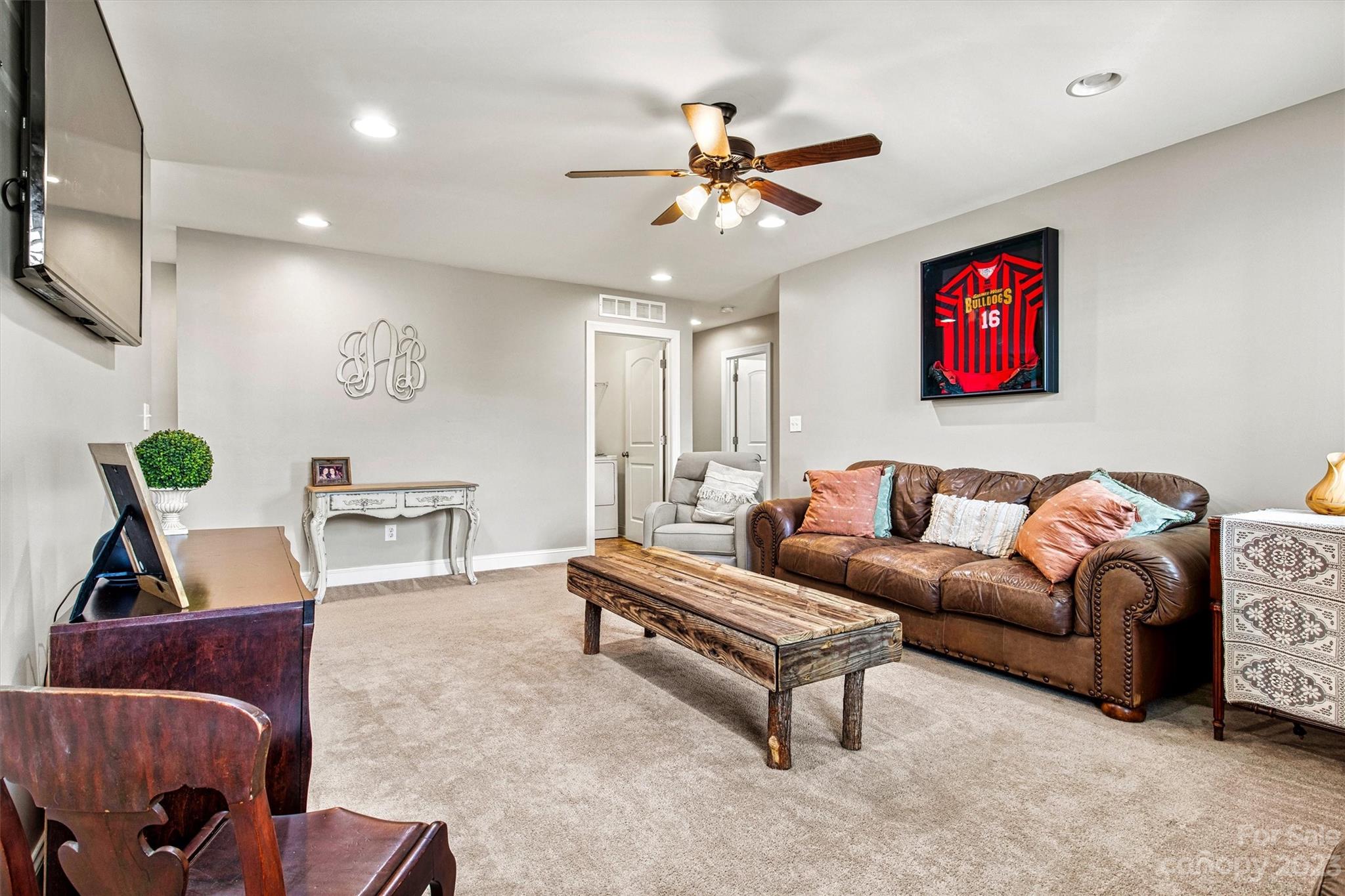 6054 Durango Way Denver, NC 28037 - Photo 25 of 38 a living room with furniture and a chandelier