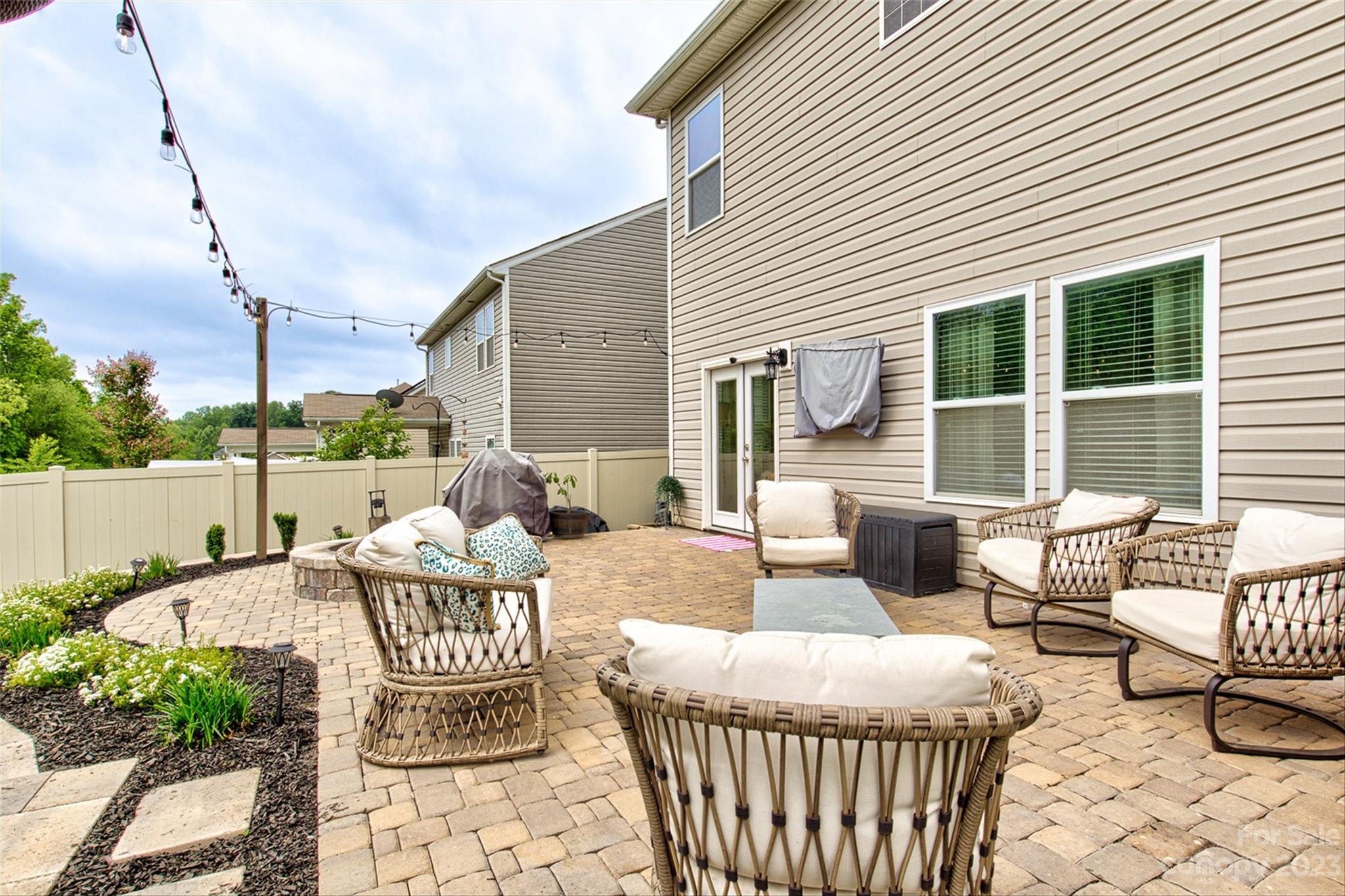6054 Durango Way Denver, NC 28037 - Photo 36 of 38 a view of a patio with couches chairs and wooden floor