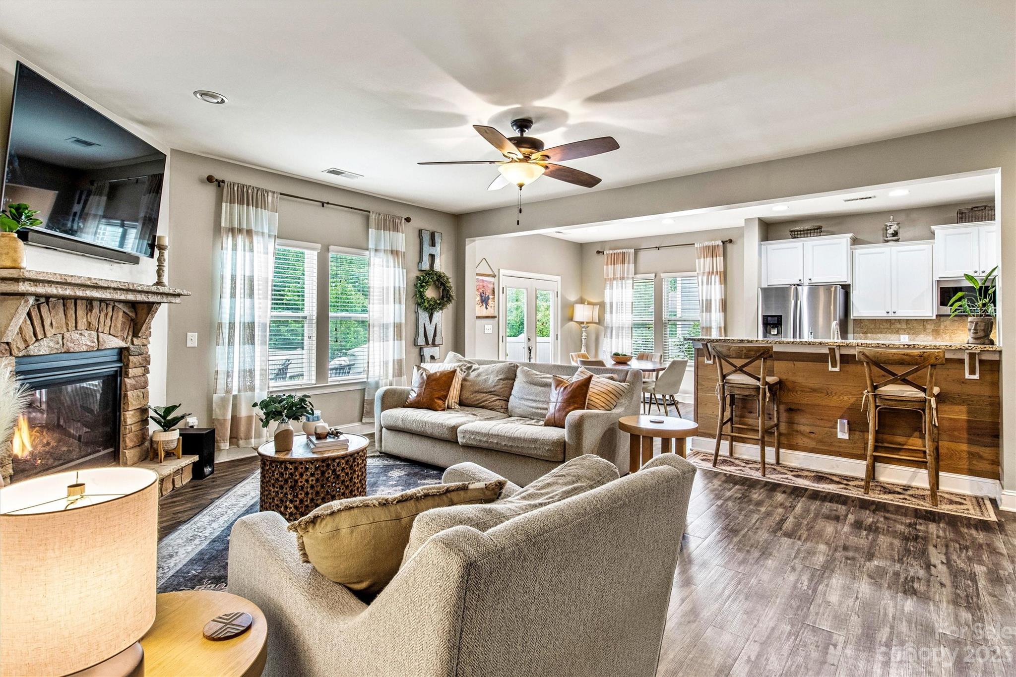 6054 Durango Way Denver, NC 28037 - Photo 4 of 38 a living room with furniture kitchen view and a large window
