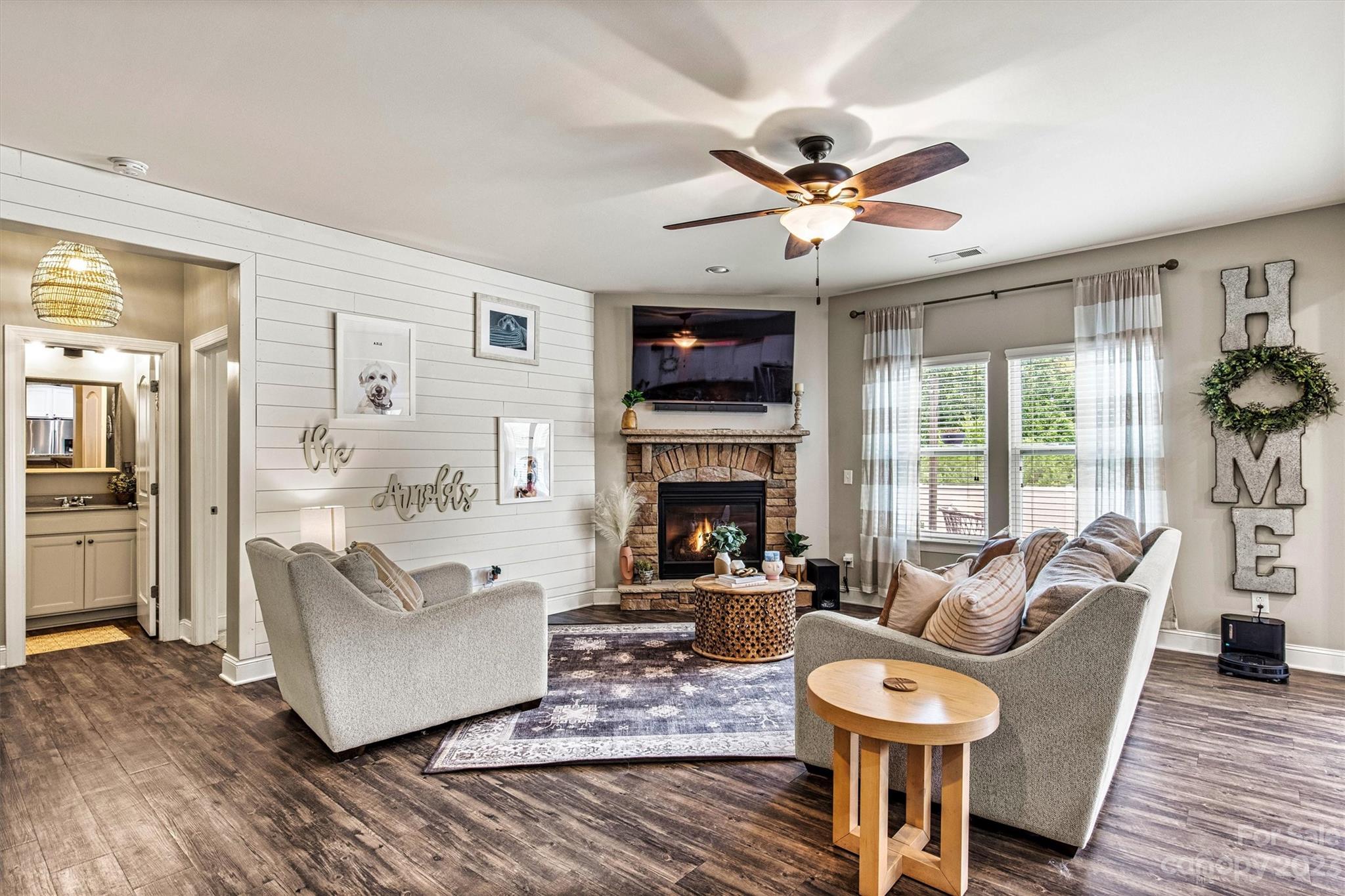 6054 Durango Way Denver, NC 28037 - Photo 6 of 38 a living room with fireplace furniture and a flat screen tv