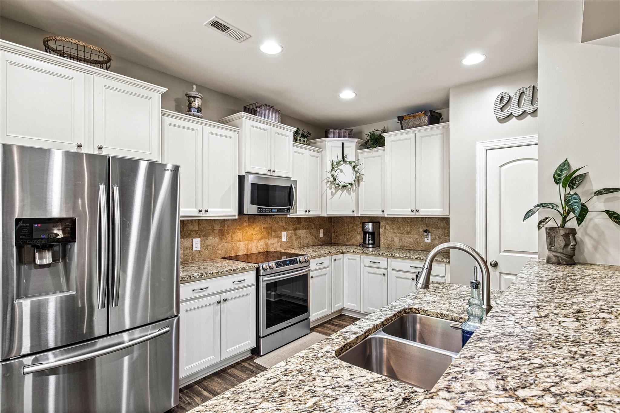 6054 Durango Way Denver, NC 28037 - Photo 9 of 38 a kitchen with stainless steel appliances granite countertop a refrigerator a sink a stove a microwave and cabinets