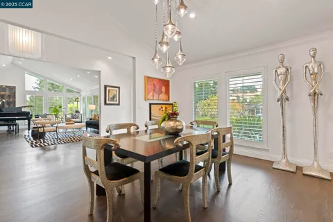 a living room with furniture large window and a flat screen tv