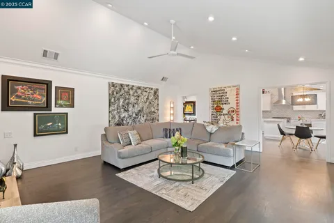 a kitchen with a sink a counter top space and stainless steel appliances