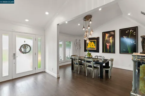a view of a livingroom with furniture and a flat screen tv